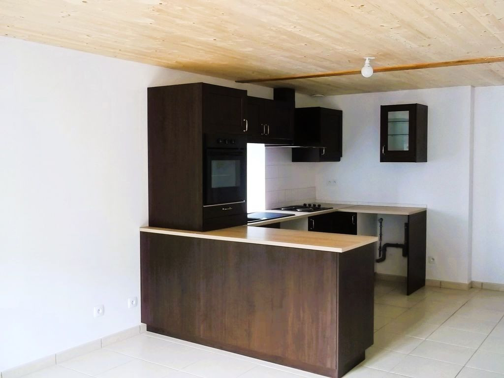 Propriété composée de 4 appartements + Terrain + Garage