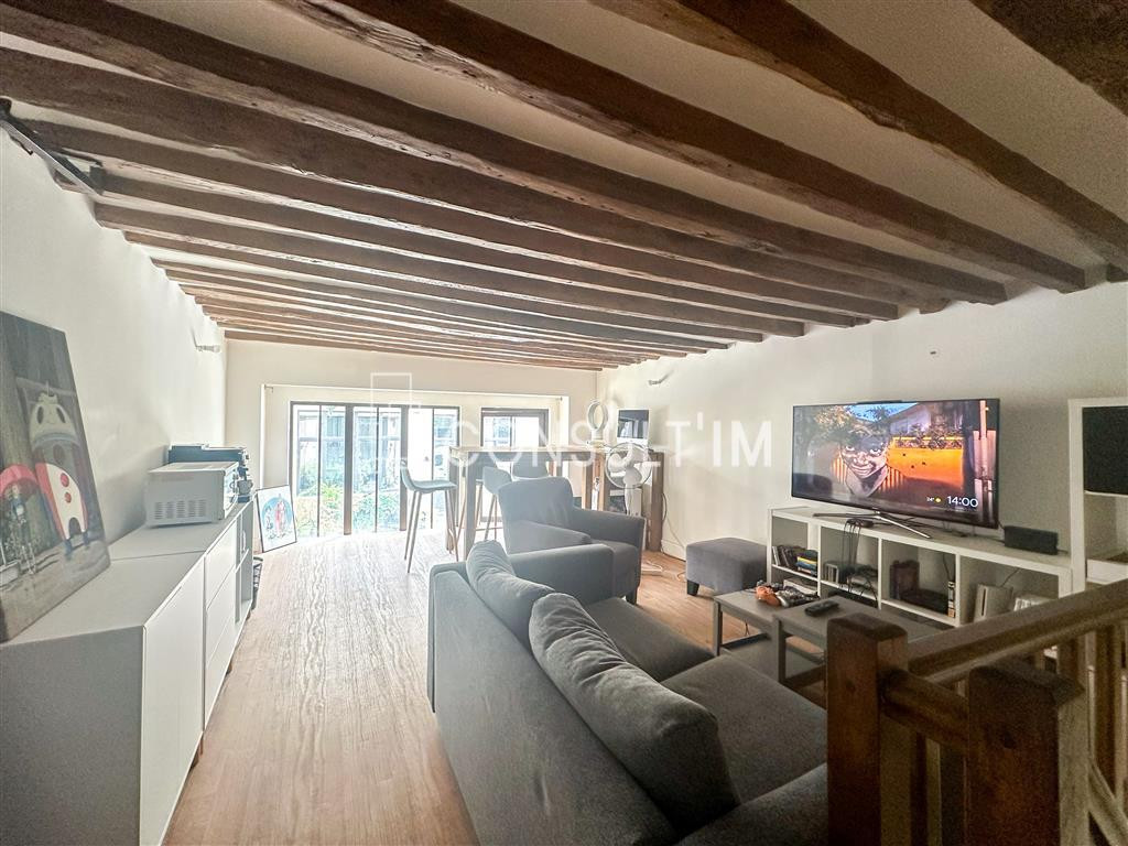 Bureaux en duplex type loft avec pierres et poutres apparentes