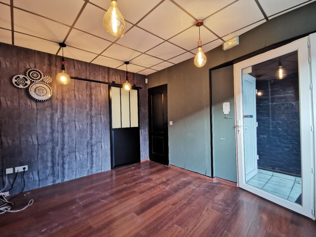 IMMEUBLE COMPOSE D'UN LOCAL COMMERCIAL ET D'UN APPARTEMENT